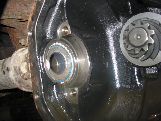 Close-up of a differential housing showing a bearing and a gear