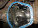 1995 Ford C-350 (Centurion Conversions) - The differential housing is open, revealing the internal gears and a fresh blue sealant application.