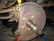 1995 Ford C-350 (Centurion Conversions) - Front wheel hub and brake rotor assembly, likely from a truck or large SUV, undergoing maintenance.