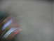 1995 Ford C-350 (Centurion Conversions) - The image shows a blurry, abstract view of a vehicle part with red, white, and blue colors, making identification difficult.