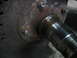 1995 Ford C-350 (Centurion Conversions) - This image shows a heavily rusted wheel hub and axle component, likely from a vehicle undergoing maintenance.