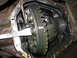 1995 Ford C-350 (Centurion Conversions) - Close-up view of a vehicle's differential, showing gears and bearings, likely during a rebuild.