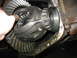 1995 Ford C-350 (Centurion Conversions) - The differential housing is open, revealing the ring gear and pinion gear assembly with a bearing.