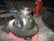 1995 Ford C-350 (Centurion Conversions) - A differential gear assembly and its ring gear are shown disassembled, resting on a red cloth with tools nearby.