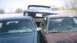 1978 Ford Bronco - Two sedans are parked nose-to-nose, with a truck visible behind them.