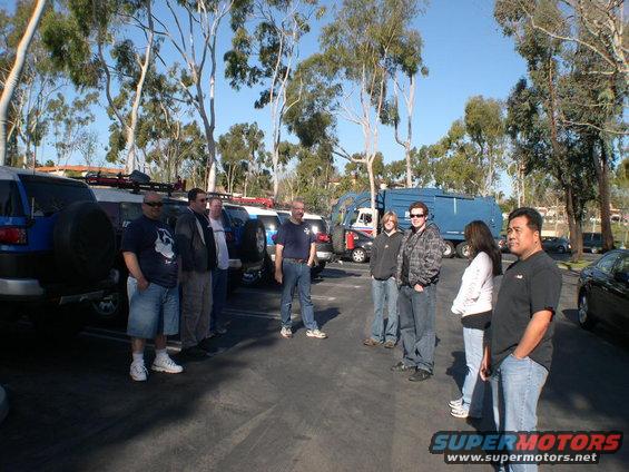 2007 Toyota FJ Cruiser SUVs parked in a lot with people