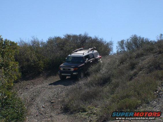 Dark 2007 Toyota FJ Cruiser on a dirt trail
