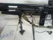 1985 Ford Bronco - A paintball gun is shown with a bipod and a Yukon night vision attachment, along with a sling and earbuds.
