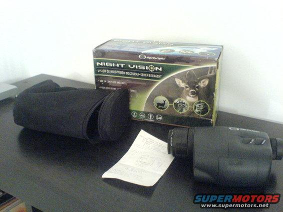 Night vision monocular with case and box showing a deer