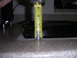 2002 BMW M3 - A tape measure is used to measure the height of a black automotive part, indicating it is approximately 3 inches tall.