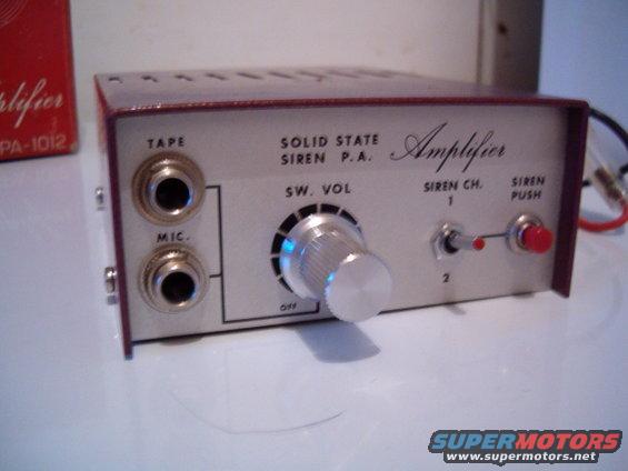 Amplifier with tape and mic inputs, volume knob, and siren channel switch