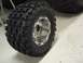 1974 Ford Bronco - A close-up view of an off-road tire and rim, a tread design suitable for challenging terrain.