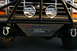 1986 Ford Bronco - This Ford Bronco features a custom front bumper with integrated skid plate and auxiliary lighting.