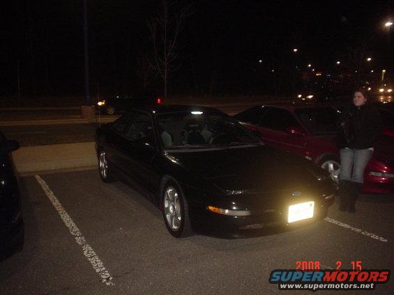 Black 1994 Ford Probe parked at night
