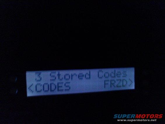 Car's dashboard display shows '3 Stored Codes' and '<CODES FRZD>'