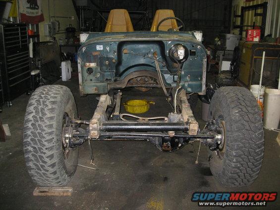 1994 Jeep YJ chassis with body tub, front view. Seats and steering wheel visible