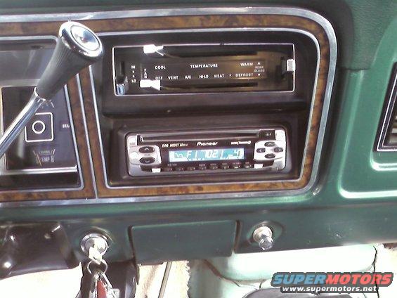 Interior view of a car dashboard showing a Pioneer stereo and climate controls