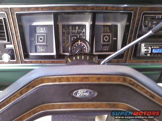 Ford steering wheel and dashboard gauges, including speedometer and fuel level indicators