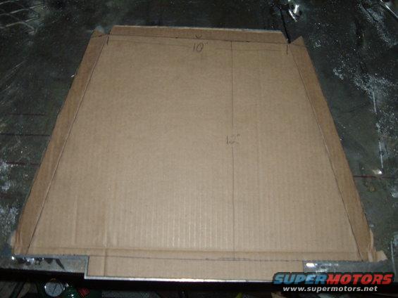 Cardboard template with '10"' and '12"' markings, likely for a motorcycle part