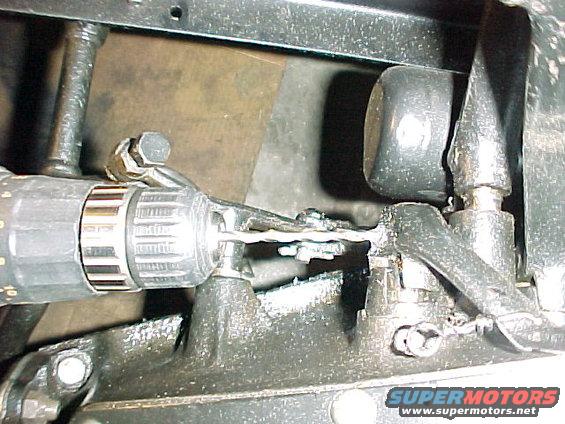 mvc112f.jpg Drilling out the rivet from the brake pedal