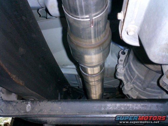 Underneath view of vehicle exhaust pipe and transmission housing