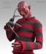 1970 Mercury Cougar - A figure of Freddy Krueger, a horror character, is shown from the chest up, holding his signature bladed glove.