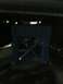 2001 Nissan Frontier - A blue metal support structure is visible in this dimly lit scene.