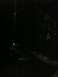 2001 Nissan Frontier - The photo shows a dark interior with some blurry reflections, making it difficult to identify any specific details.