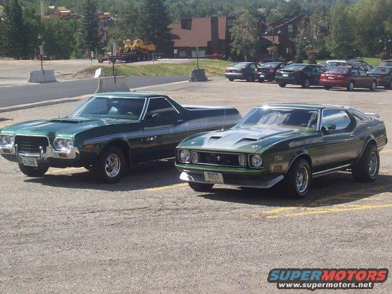 Green 1971 Ford Mustang Mach 1 with a "BOSS" plate