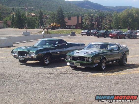 1971 Ford Mustang Mach 1 and a green Ford Ranchero parked side-by-side