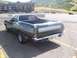 1972 Ford Ranchero - Rear view of a green 1972 Ford Ranchero GT with a silver stripe and a license plate reading 'Q-CODE'.