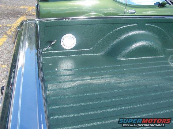 Green 1972 Ford Ranchero bed with chrome trim and fuel cap. Text reads 'Jet fuel only'