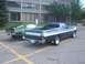 1972 Ford Ranchero - Two green Ford vehicles, a 1972 Ranchero and a Mustang, are parked side-by-side.