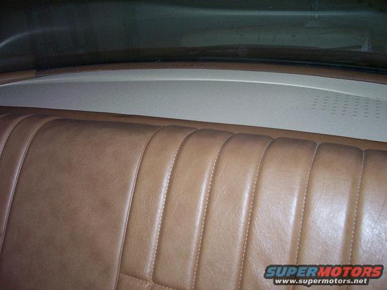 Brown vinyl rear seat with vertical stitching, viewed from above