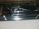 1995 Ford Probe - A close-up of a chrome trim piece, likely a car emblem, is shown wrapped in protective plastic.
