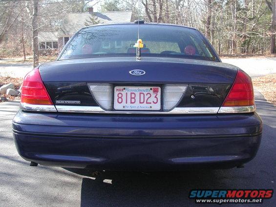Dark blue Ford Crown Victoria rear view, chrome trim, Massachusetts license plate 81B D23