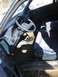 1999 Ford Taurus - The interior of a car, a blue dashboard and seats, is shown from the passenger side.