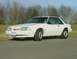1993 Ford Mustang - This white 1993 Ford Mustang coupe is shown from a 3/4 front angle, with its license plate E88-FUY clearly visible.
