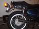 1978 Honda CB500T - The rear section of a motorcycle is visible, including its wheel, seat, and exhaust pipe. A toolbox sits in the background.