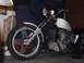 1978 Honda CB500T - A custom motorcycle with a white fuel tank and a spiked front fender sits in a garage.