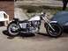 1978 Honda CB500T - A custom 1978 Honda CB500T motorcycle is parked on a concrete driveway next to a brick wall and a car cover.