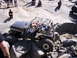 1989 Ford Bronco - This heavily modified off-road vehicle is shown tackling a challenging rocky obstacle course.