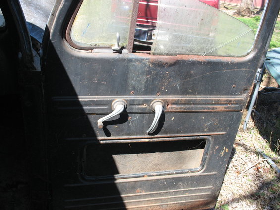 1952 Ford Panel Van door interior, showing two door handles and a window