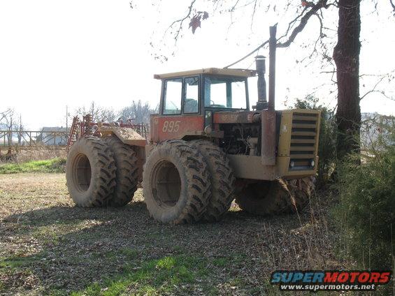 Red Versatile. This one's set up more set up for pulling than getting through hairy terrain. It doesn't have lockers, weighs a shit-ton (all 8 tires have the max amount of ballast), and has wimpy tires. However, the hopped up 855 cid Cummins puts out all kinds of torque.