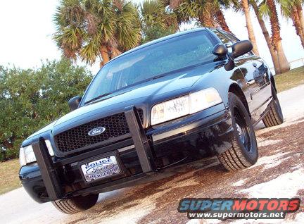 Black 2001 Ford Crown Victoria police car, front view with push bumper