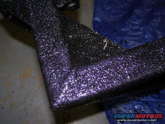 Close-up of a textured rear bumper, possibly from a truck or SUV