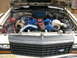 1985 Ford Crown Victoria LTD - The engine bay features a V8 with twin turbochargers and custom blue wiring.
