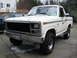 1980 Ford Bronco - This 1980 Ford Bronco features a distinctive camouflage stripe along its side and aftermarket wheels.