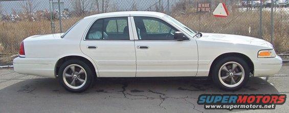 White 2004 Ford Crown Victoria sedan, side view