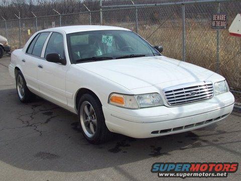 2004 Ford Crown Victoria sedan parked outdoors, front quarter view